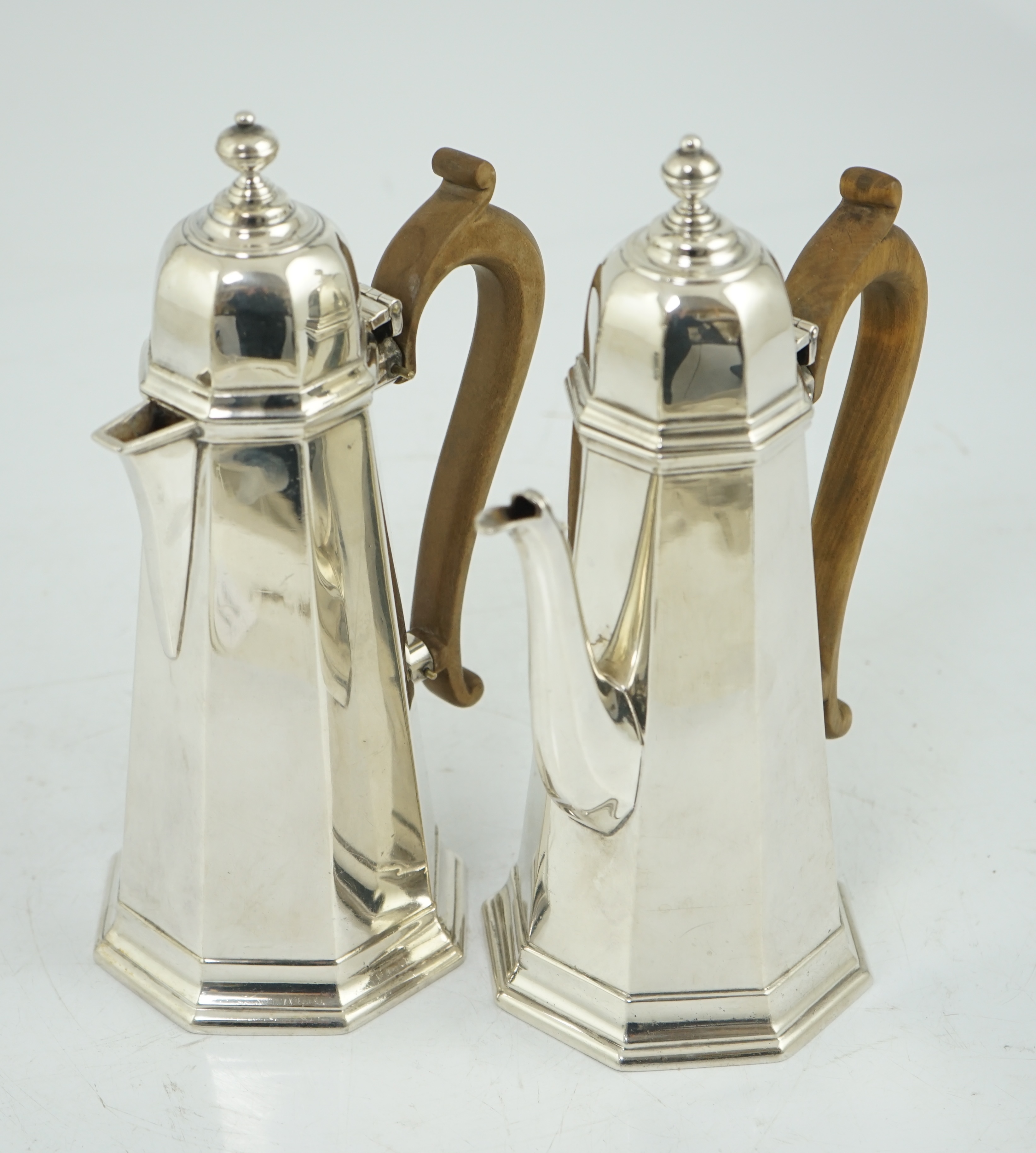 A George V 18th century style silver cafe au lait pair by Garrard & Co